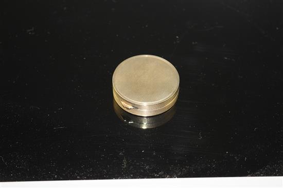 A George V engine turned 9ct gold circular compact, London, 1928, 38mm, gross 21.8 grams.